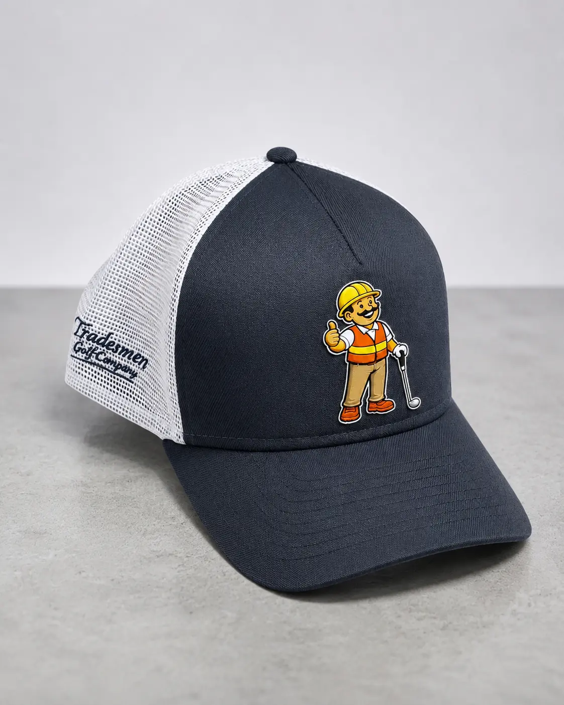 High-resolution navy and white Tradesmengolf trucker hat with the Union Jack golfer mascot